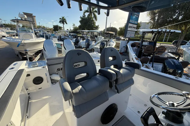  Yacht Photos Pics 2026 Sea Pro 292 DLX boat interior with dual seats and steering wheel.