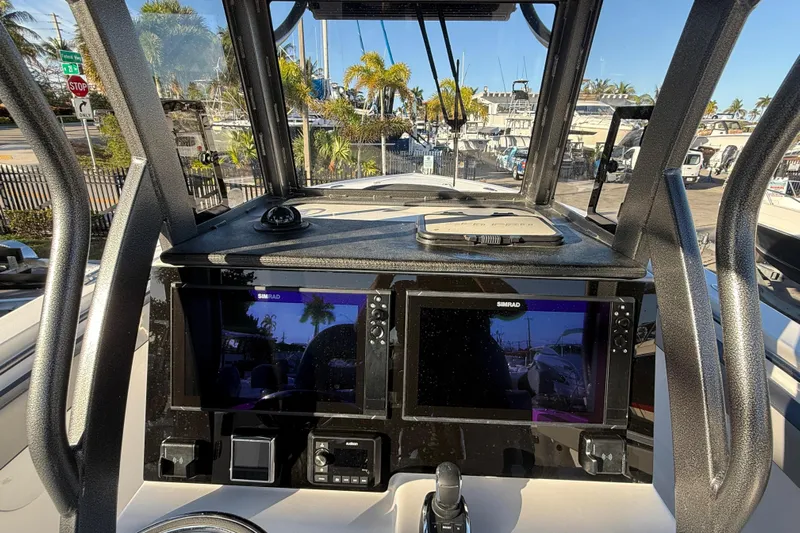  Yacht Photos Pics 2026 Sea Pro 292 DLX boat dashboard with dual Simrad displays and modern controls.