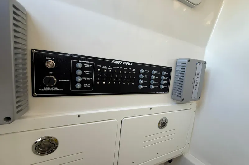  Yacht Photos Pics 2026 Sea Pro 292 DLX control panel with switches and Hertz audio component.
