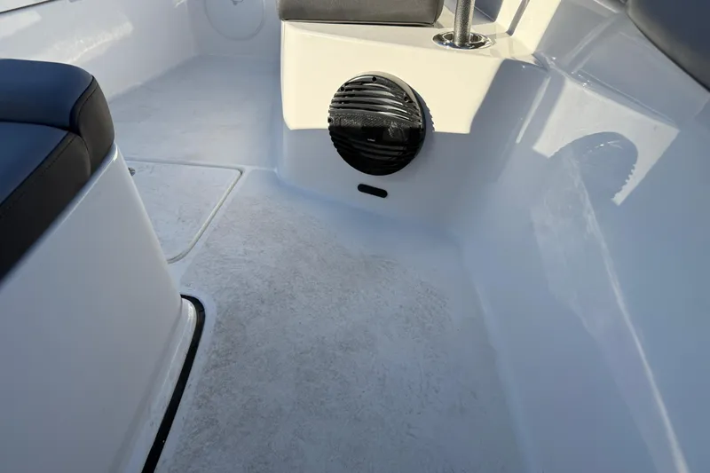  Yacht Photos Pics Interior of 2026 Sea Pro 292 DLX boat, featuring seating and speaker.