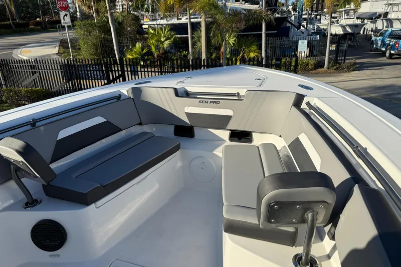  Yacht Photos Pics 2026 Sea Pro 292 DLX boat interior with gray seating and modern design.