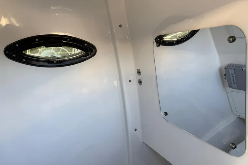  Yacht Photos Pics Interior of 2026 Sea Pro 292 DLX boat with porthole and mirror.