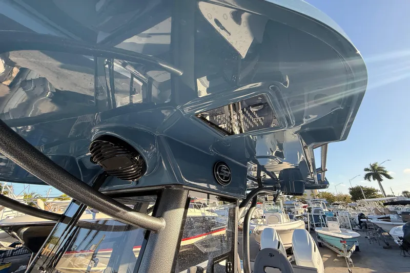  Yacht Photos Pics 2026 Sea Pro 292 DLX boat with sleek design and modern features, docked under clear sky.