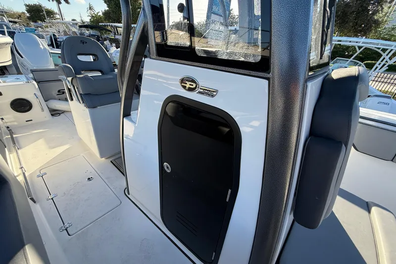  Yacht Photos Pics 2026 Sea Pro 292 DLX boat interior with seating and console details.