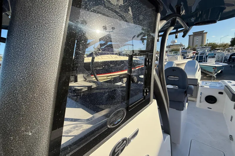  Yacht Photos Pics 2026 Sea Pro 292 DLX boat interior with seating and control panel.