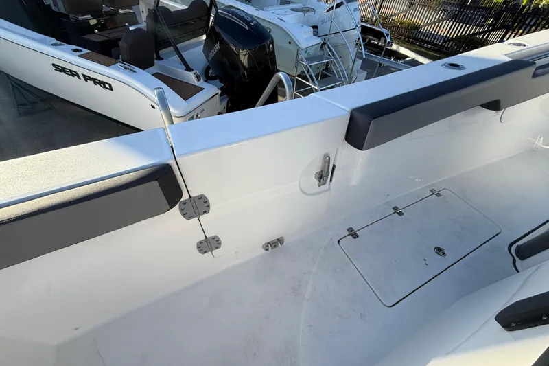 Yacht Photos Pics 2026 Sea Pro 292 DLX boat interior, featuring sleek design and modern seating.