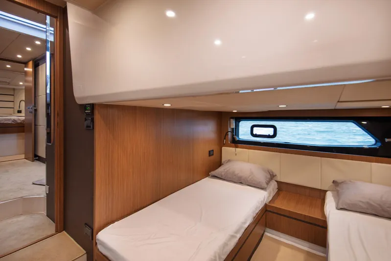  Yacht Photos Pics Interior of 2016 Azimut Atlantis 43 yacht with twin beds and ocean view window.
