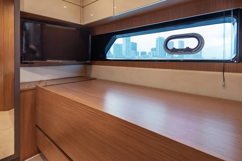  Yacht Photos Pics Interior of 2016 Azimut Atlantis 43 yacht with wood finish and cityscape view.