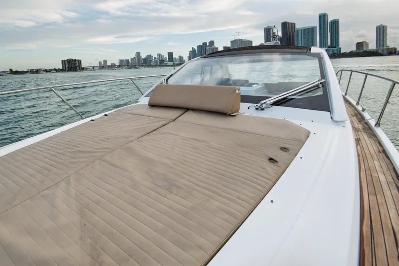  Yacht Photos Pics 2016 Azimut Atlantis 43 yacht with sunbed, city skyline in background.