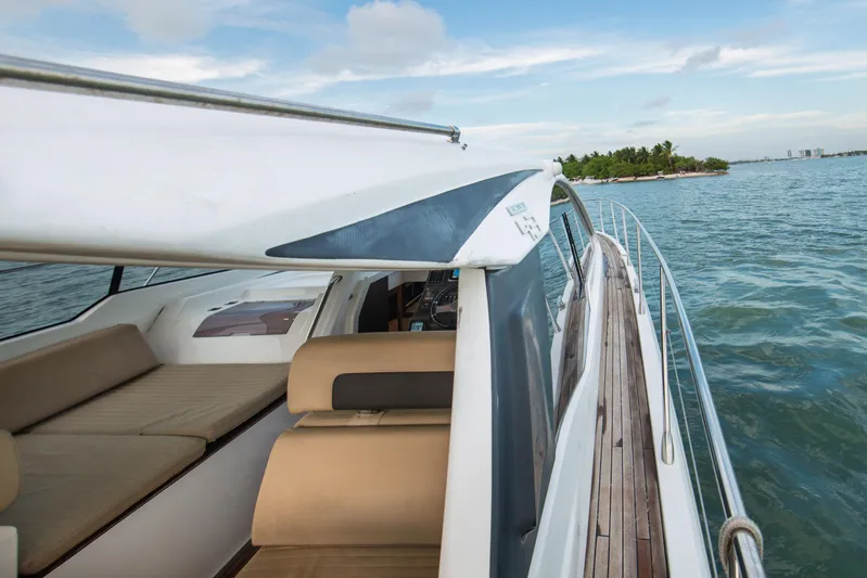  Yacht Photos Pics 2016 Azimut Atlantis 43 yacht cruising near tropical island, showcasing sleek design and luxury.