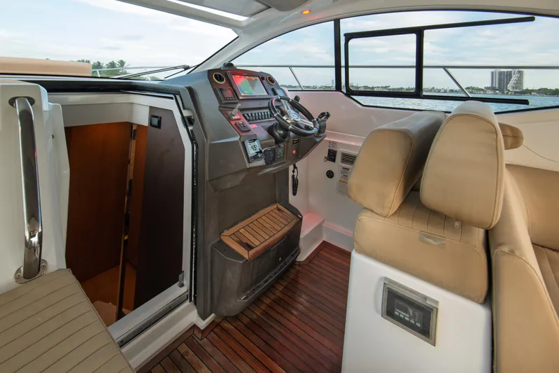  Yacht Photos Pics Interior view of 2016 Azimut Atlantis 43 yacht cockpit with modern controls and seating.