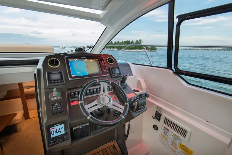  Yacht Photos Pics Cockpit of 2016 Azimut Atlantis 43 yacht with navigation controls and sea view.