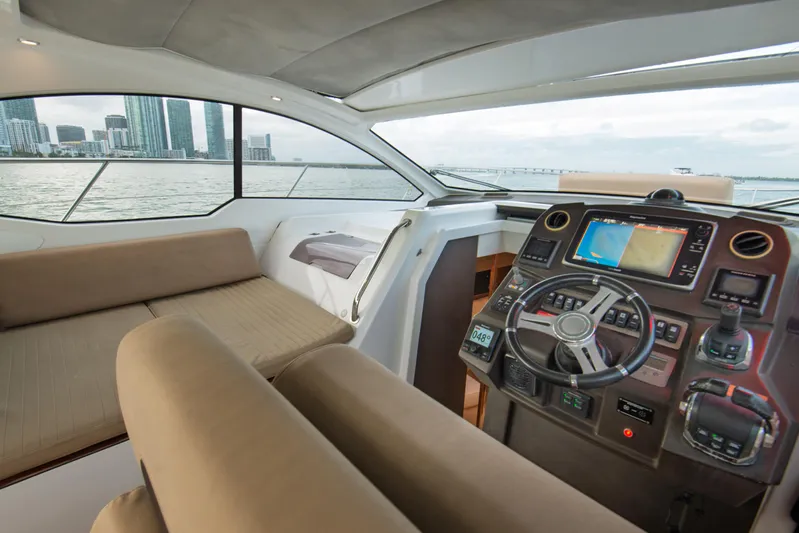  Yacht Photos Pics Interior of 2016 Azimut Atlantis 43 yacht with modern helm and city skyline view.