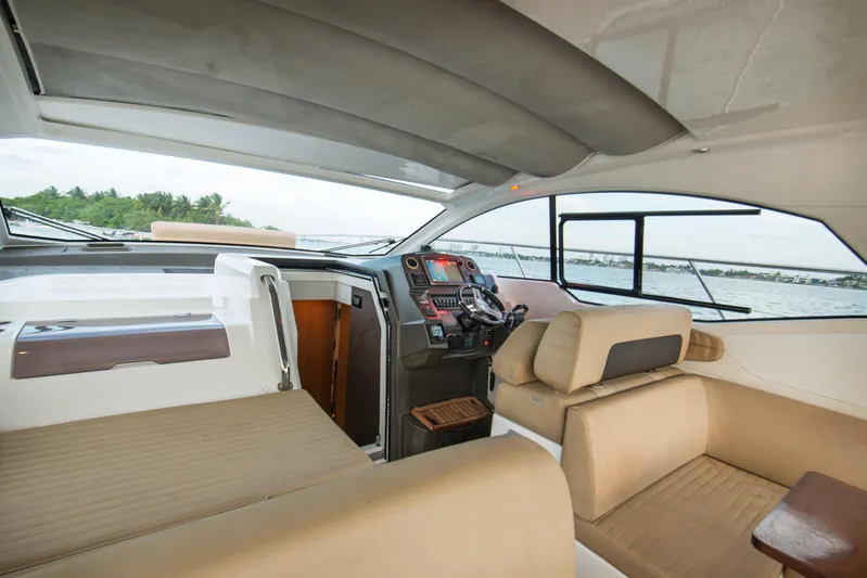  Yacht Photos Pics Interior of 2016 Azimut Atlantis 43 yacht, featuring luxurious seating and modern helm.