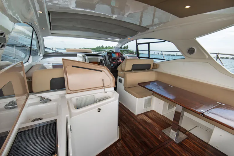  Yacht Photos Pics Luxurious interior of 2016 Azimut Atlantis 43 yacht with elegant seating and wooden flooring.