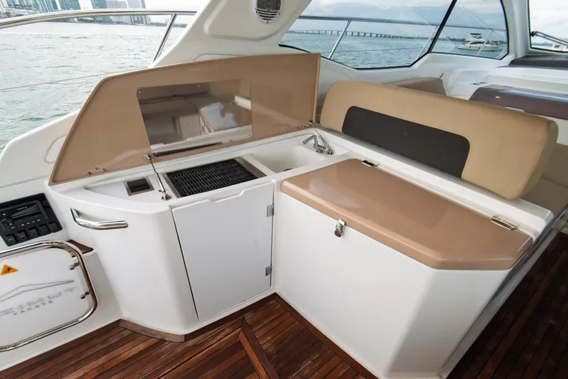  Yacht Photos Pics Azimut Atlantis 43 yacht interior, 2016 model, featuring a sleek kitchenette and seating area.