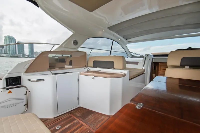 Yacht Photos Pics Interior of 2016 Azimut Atlantis 43 yacht with modern seating and wooden accents.