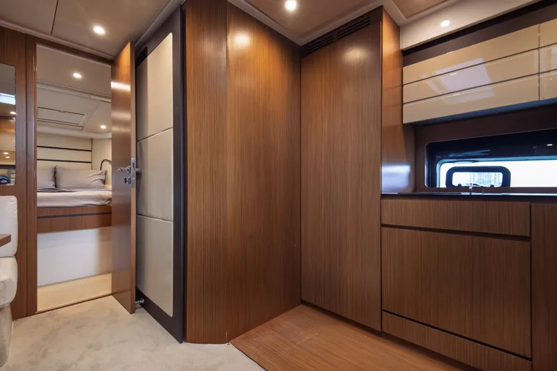  Yacht Photos Pics Luxurious interior of 2016 Azimut Atlantis 43 yacht with wood paneling and modern design.