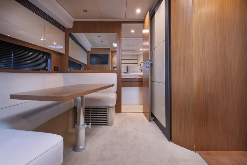  Yacht Photos Pics Interior of 2016 Azimut Atlantis 43 yacht with modern seating and wooden finishes.