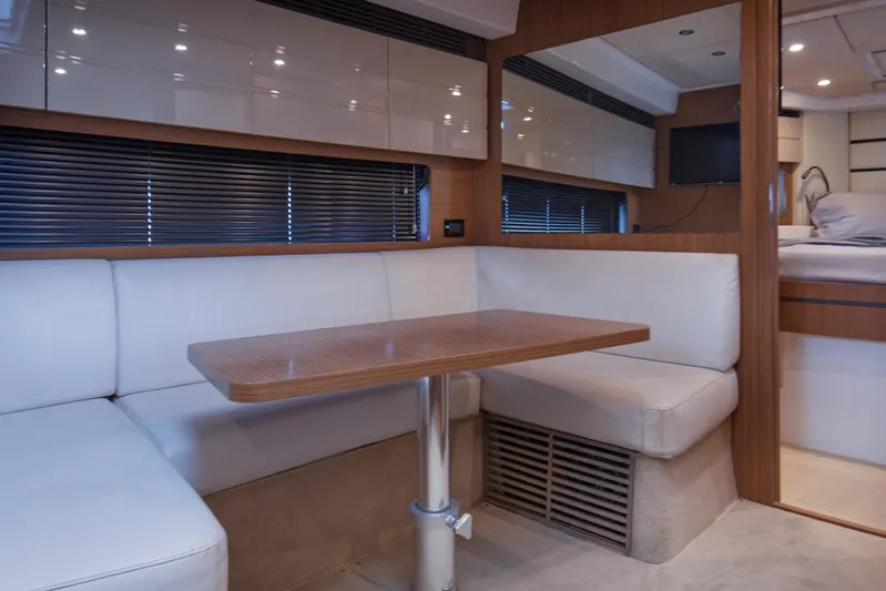  Yacht Photos Pics Luxurious interior of 2016 Azimut Atlantis 43 yacht with cozy seating and wooden table.