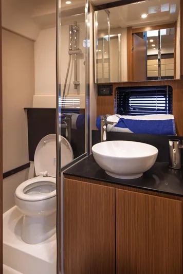  Yacht Photos Pics Luxurious bathroom in 2016 Azimut Atlantis 43 yacht with modern fixtures and elegant design.