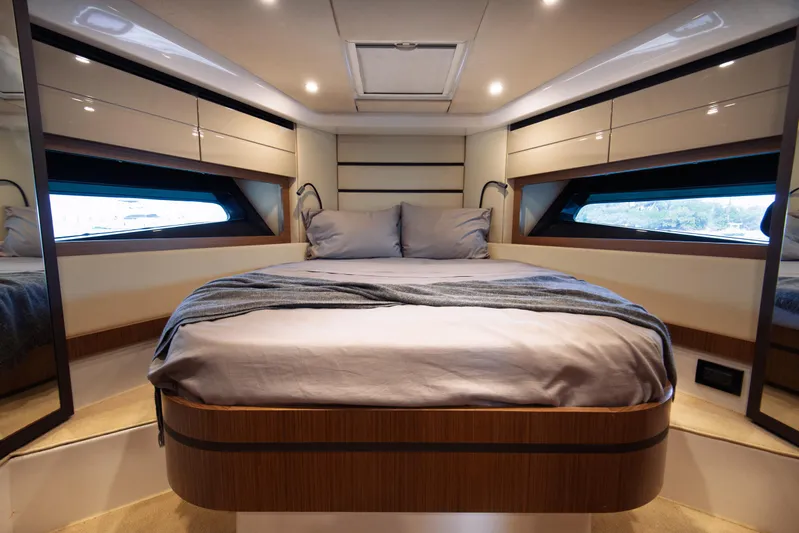  Yacht Photos Pics Luxurious bedroom interior of 2016 Azimut Atlantis 43 yacht with modern design and cozy bedding.