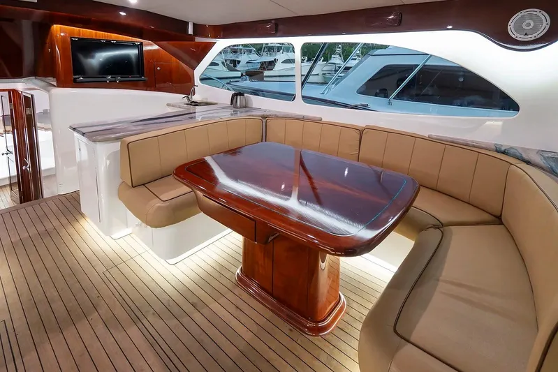 Satis Fly Yacht Photos Pics Luxurious interior of 2020 Maverick Yachts Costa Rica 50 Sportfish with elegant seating and table.