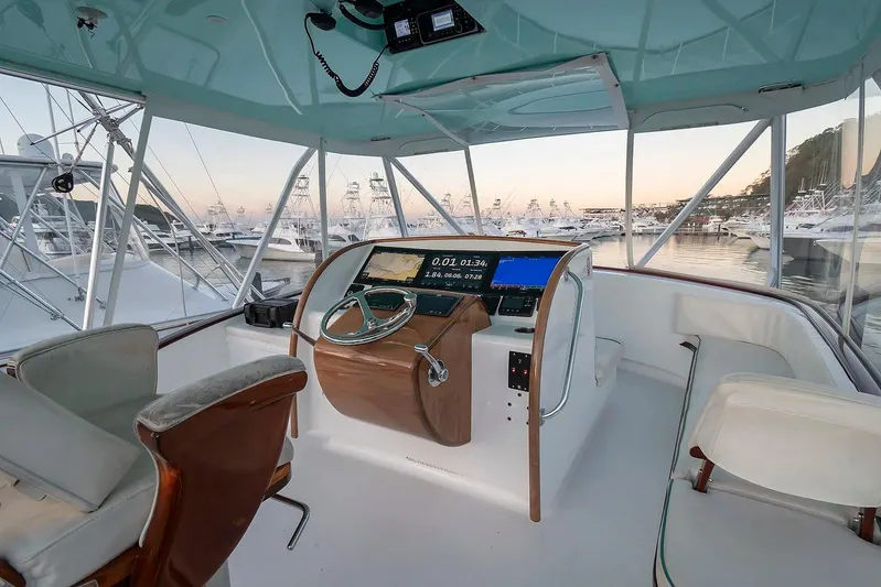 Satis Fly Yacht Photos Pics Helm of 2020 Maverick Yachts Costa Rica 50 Sportfish at marina during sunset.