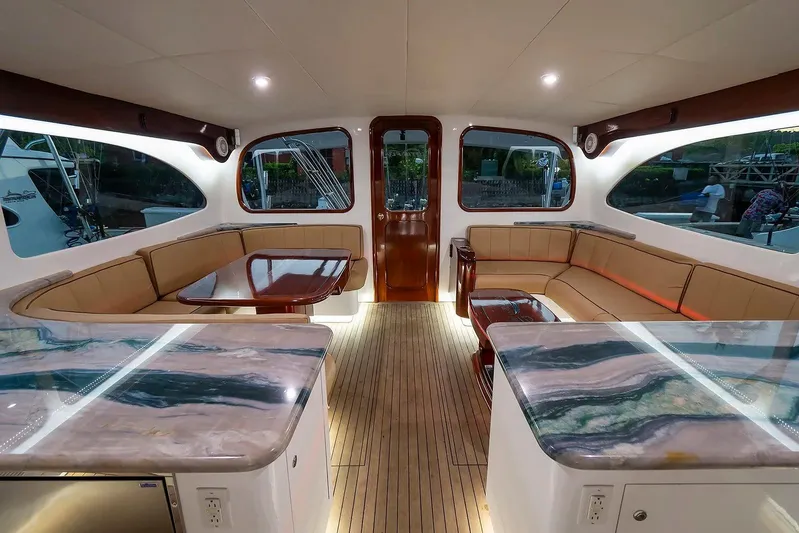 Satis Fly Yacht Photos Pics Luxurious interior of 2020 Maverick Yachts Costa Rica 50 Sportfish with elegant seating and countertops.