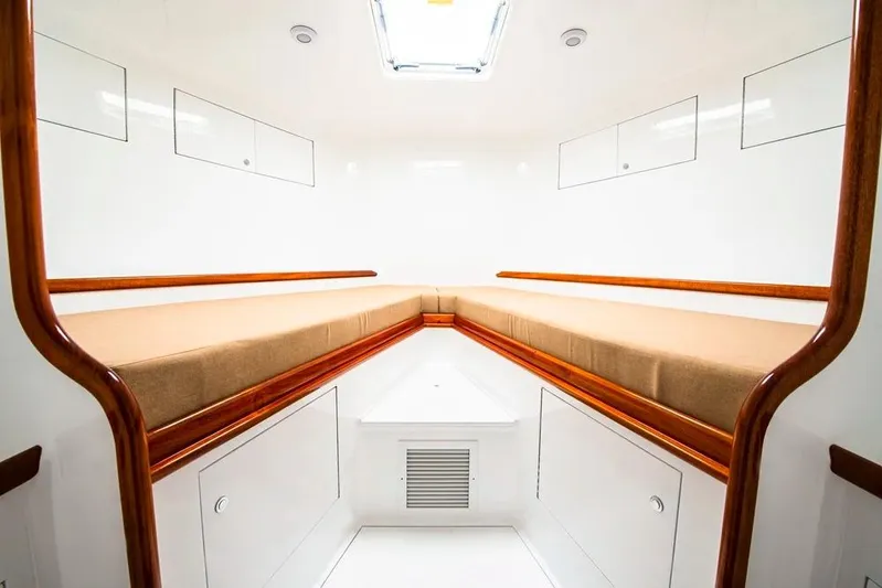 Satis Fly Yacht Photos Pics Interior of 2020 Maverick Yachts Costa Rica 50 Sportfish, featuring sleek wood accents and storage.