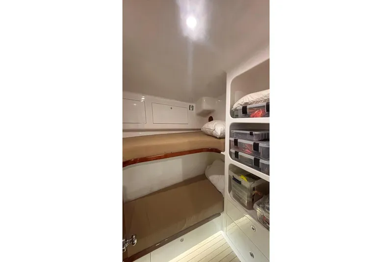 Satis Fly Yacht Photos Pics Interior cabin of 2020 Maverick Yachts Costa Rica 50 Sportfish with bunk beds and storage.