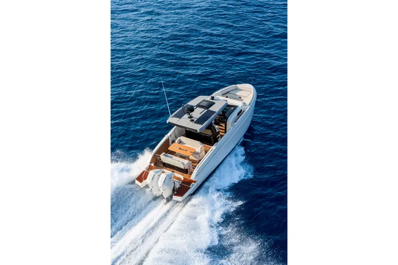 Yacht Photos Pics 2026 Beneteau Gran Turismo 35 cruising on open blue sea.