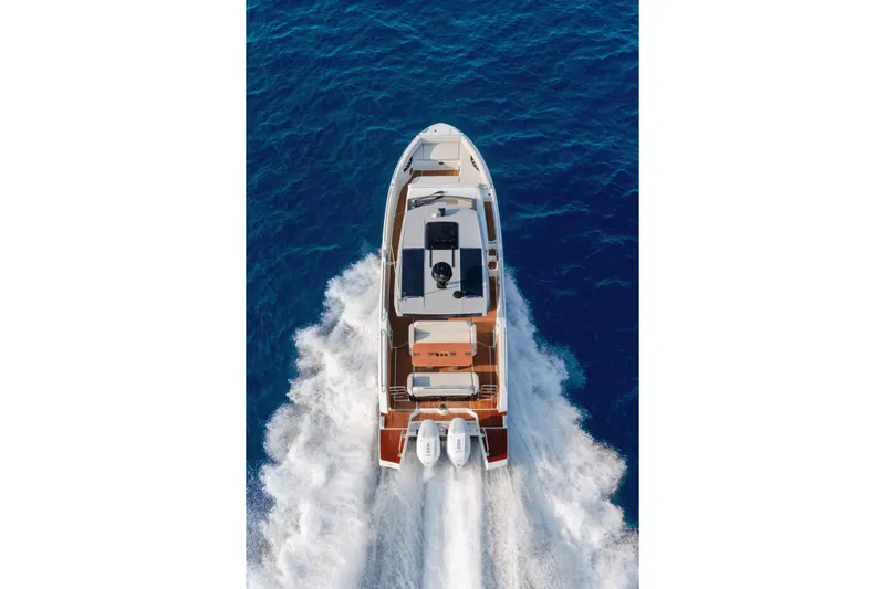  Yacht Photos Pics 2026 Beneteau Gran Turismo 35 cruising on open blue sea, aerial view.