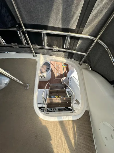 Euphoria Yacht Photos Pics Interior view of 2003 Riviera 37 Flybridge yacht, showing stairs and railing.