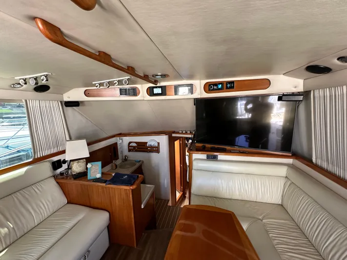 Euphoria Yacht Photos Pics Interior of 2003 Riviera 37 Flybridge yacht with leather seating and modern amenities.