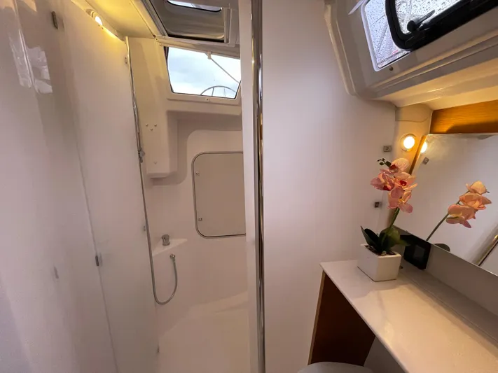  Yacht Photos Pics Luxurious bathroom in 2022 Dufour 390 Grand Prix yacht, featuring modern fixtures and elegant decor.
