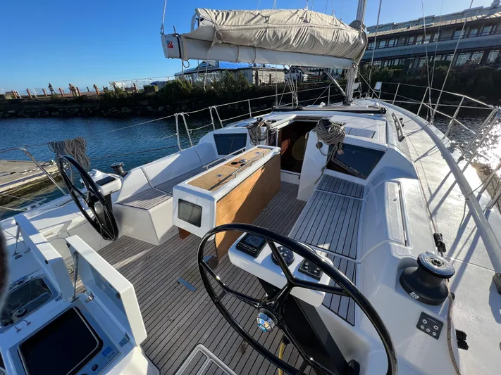  Yacht Photos Pics 2022 Dufour 390 Grand Prix sailboat cockpit with dual steering wheels and modern design.