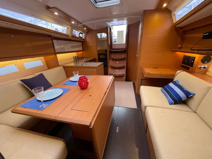  Yacht Photos Pics Interior of 2022 Dufour 390 Grand Prix sailboat, featuring elegant dining area and modern design.
