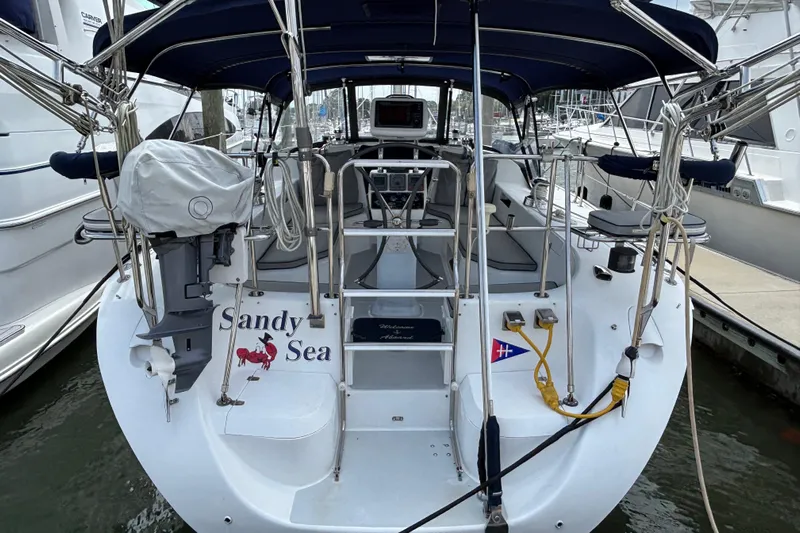 Yacht Photos Pics 2006 Catalina 42 MkII sailboat docked, featuring a spacious cockpit and covered helm.
