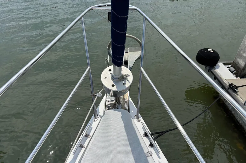  Yacht Photos Pics Bow view of 2006 Catalina 42 MkII sailboat docked on calm water.