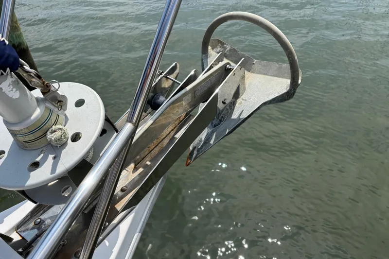  Yacht Photos Pics Bow anchor of a 2006 Catalina 42 MkII sailboat over water.