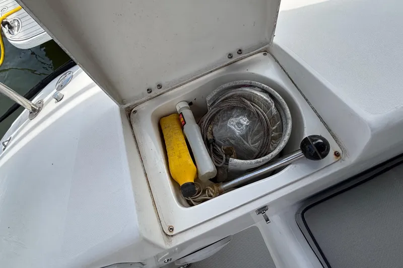  Yacht Photos Pics Open storage compartment on a 2006 Catalina 42 MkII sailboat with boating equipment.