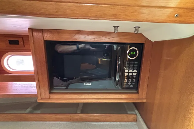  Yacht Photos Pics Microwave in 2006 Catalina 42 MkII yacht's wooden interior kitchen area.