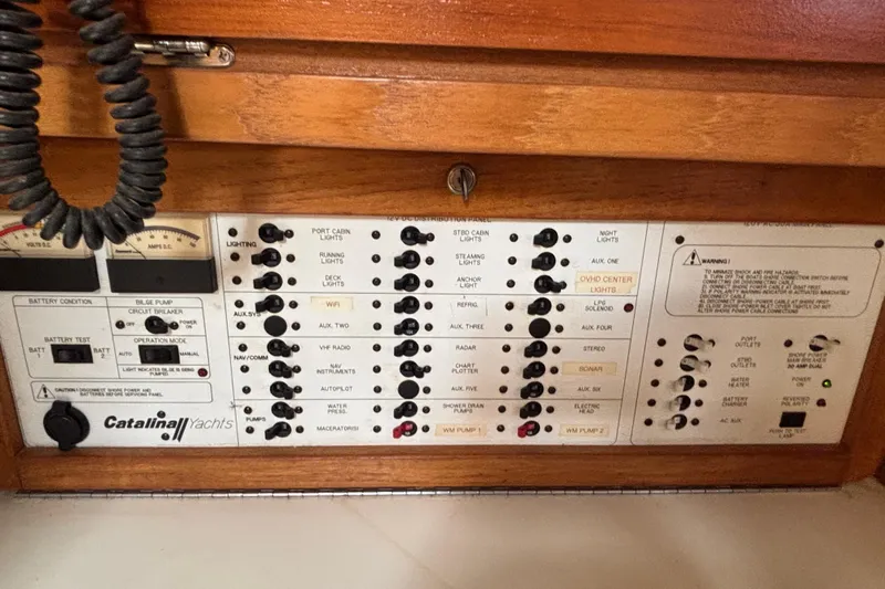  Yacht Photos Pics Control panel of a 2006 Catalina 42 MkII yacht with various switches and indicators.