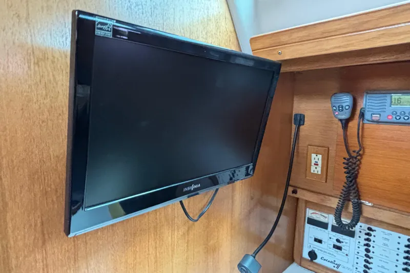  Yacht Photos Pics Flat-screen TV and communication equipment on 2006 Catalina 42 MkII yacht interior.