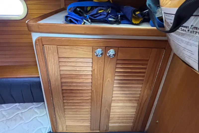  Yacht Photos Pics Wooden cabinet inside 2006 Catalina 42 MkII sailboat, with life jackets on top.