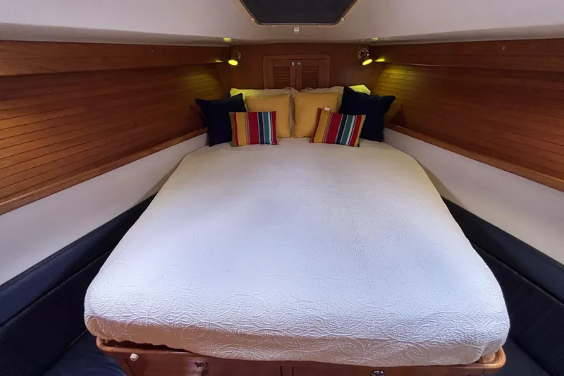  Yacht Photos Pics Luxurious cabin interior of 2006 Catalina 42 MkII sailboat with cozy bedding.