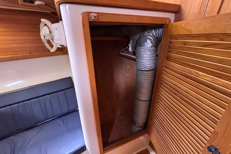  Yacht Photos Pics 2006 Catalina 42 MkII interior showing a wooden closet with ventilation duct.