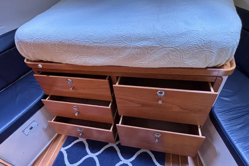  Yacht Photos Pics Interior of 2006 Catalina 42 MkII with open wooden drawers under bed.