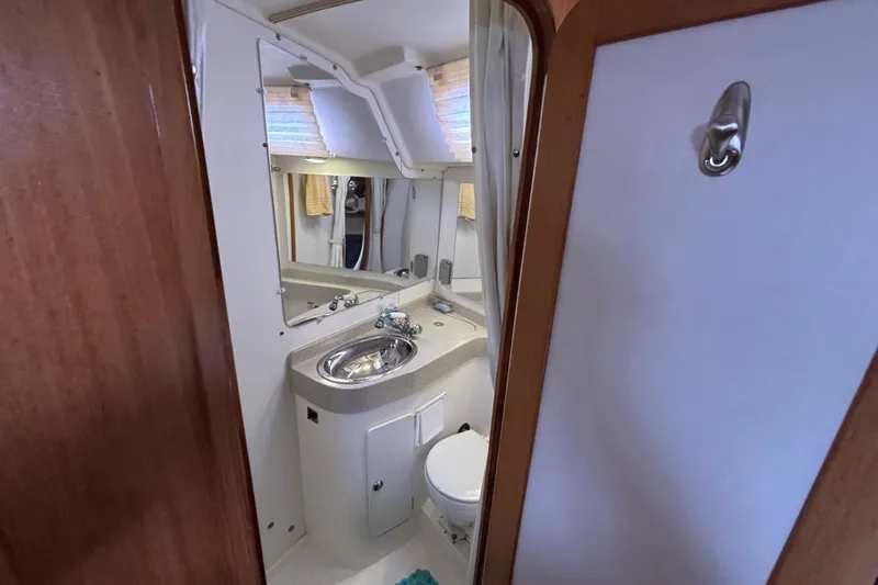  Yacht Photos Pics 2006 Catalina 42 MkII yacht bathroom with sink, mirror, and toilet.